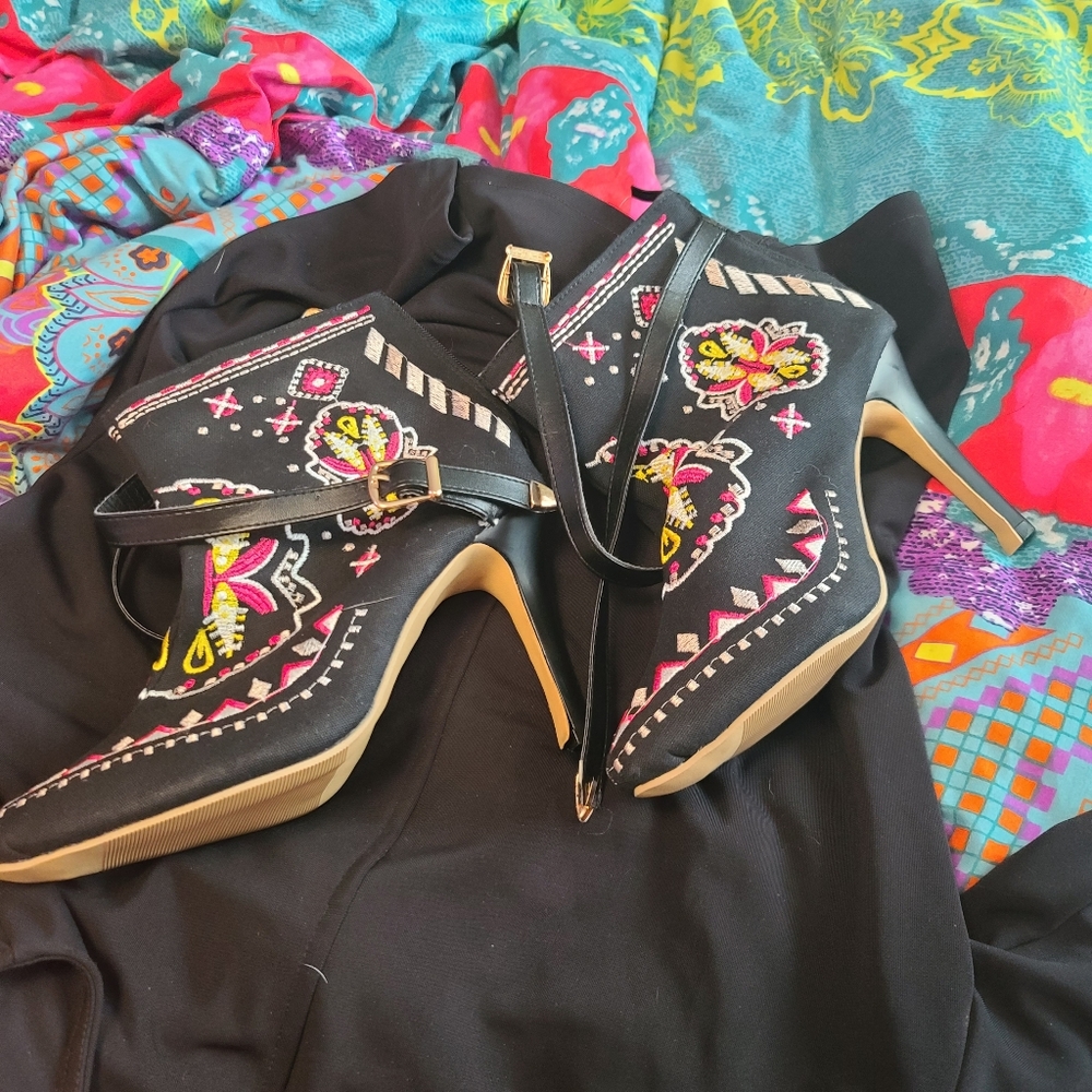 High heels with zip up back and buckles.